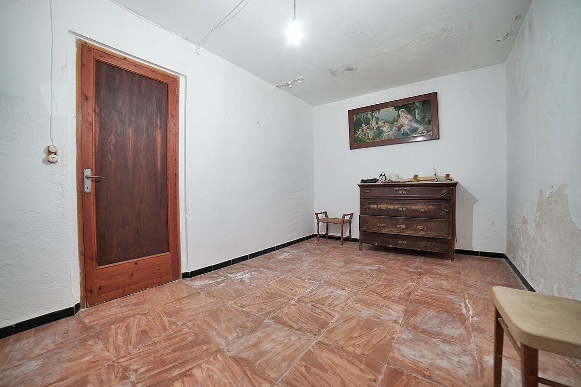 Casa de pueblo en Es Llombards con jardín y gran potencial